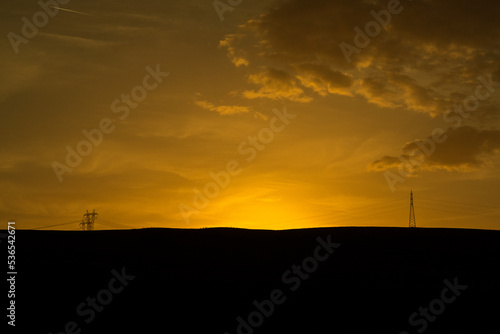 Silhouette of Power lines at sunset hour