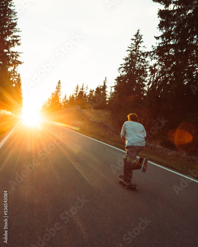 skateboarding in the mountains during sunset