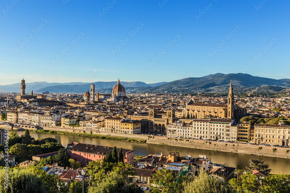 Florence, Italy. Scenic view of river and city at sunset