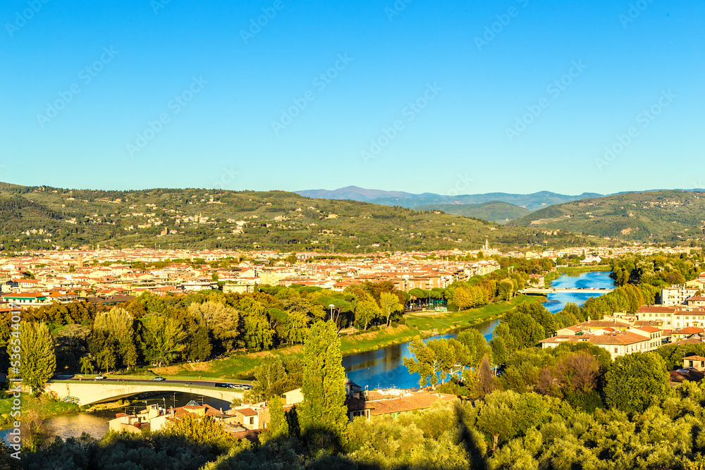 Florence, Italy. Scenic view of the Arno River, bridges and mountainous surroundings