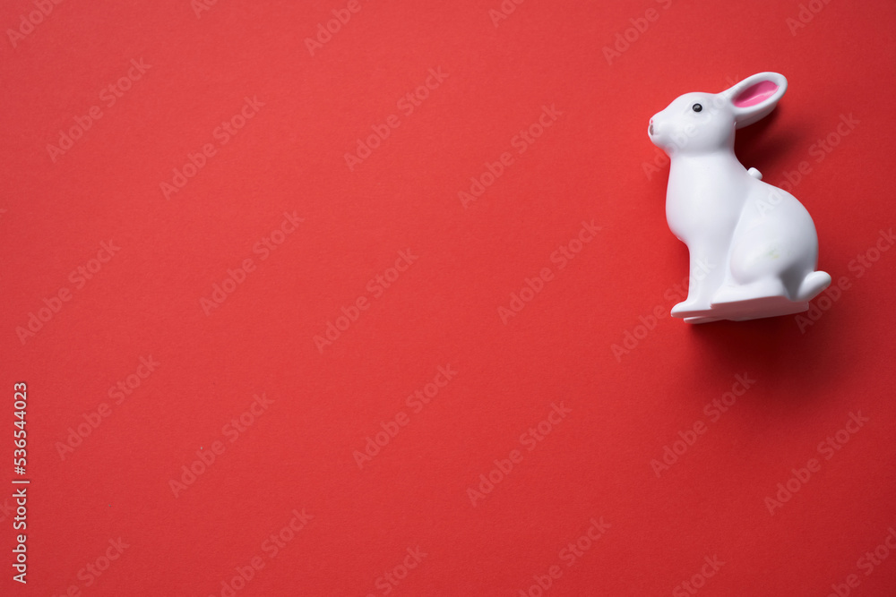 toy rabbit on red background - year of rabbit toy rabbit on red background - year of rabbit