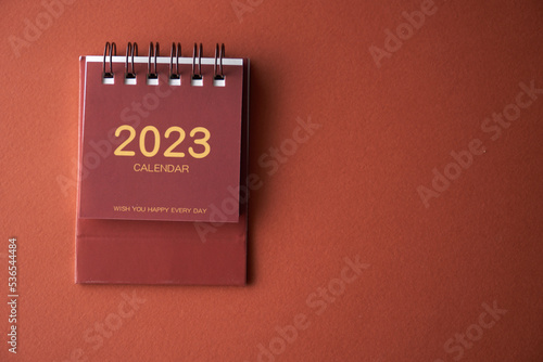 2023 desk calendar on color background