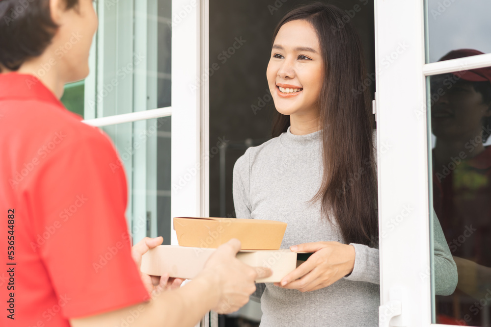 Postman, service fast food online asian young woman hand received order, delivery man, male holding, carrying paper containers, pizza box send to customer house. Deliver, courier bring product to door Postman, service fast food online asian young woman hand received order, delivery man, male holding, carrying paper containers, pizza box send to customer house. Deliver, courier bring product to door