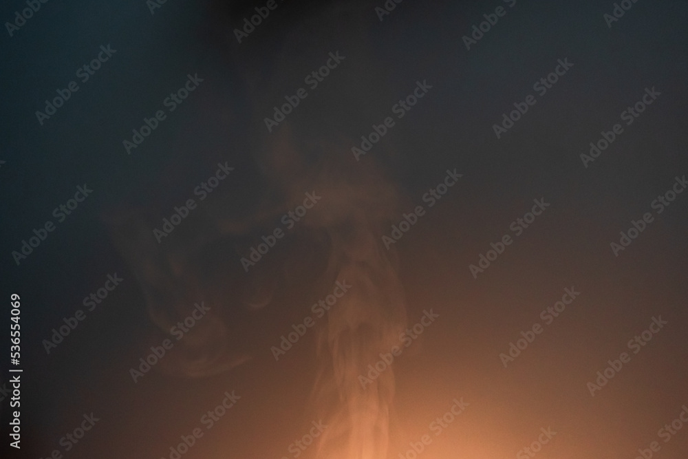 Abstract smoke / steam in glow of lamp