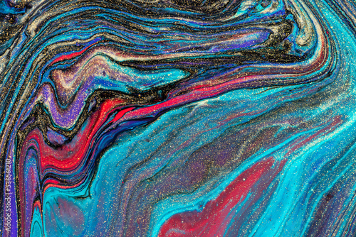 Abstract background from flowing colored liquid paints