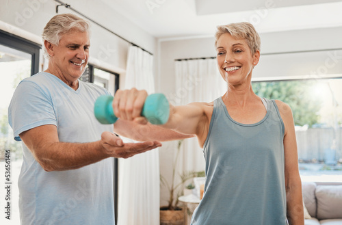 Home workout, senior couple and dumbbell training exercise for fitness, wellness and healthy lifestyle in Australia. Happy elderly man help support strong woman with challenge, power and body muscle