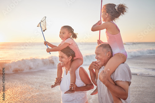 Cuadro en lienzo Children, grandparents and piggy back on beach on summer holiday walking in sea sand