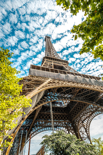 The famous Eiffel Tower in Paris with a dramatic sky