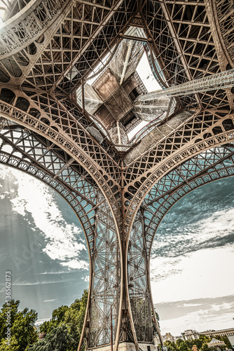 The famous Eiffel Tower in Paris with a dramatic sky
