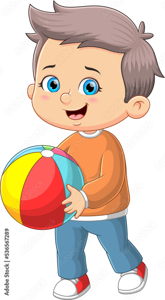 The cute boy is running and playing the rainbow ball The cute boy is running and playing the rainbow ball