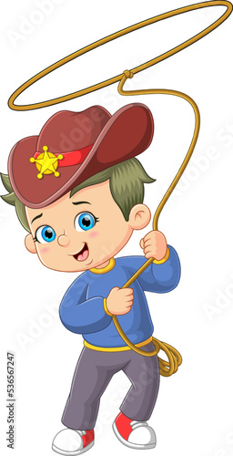 The cute cowboy boys is playing the hole rope