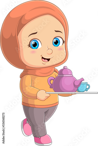 The cute young girl is serving tea pot for the guest in the living room