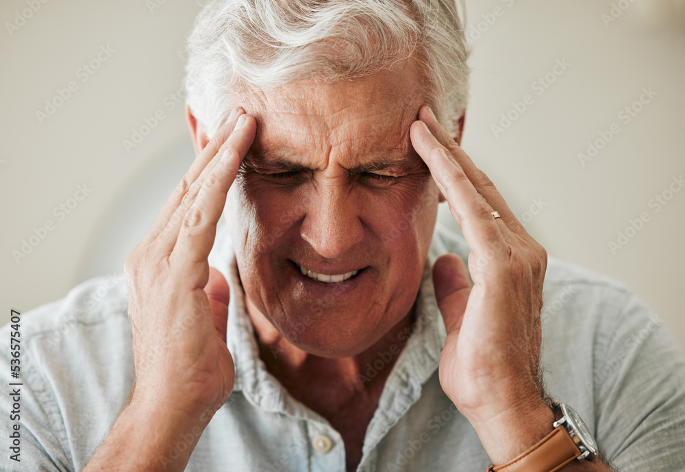 Senior man, suffering with headache pain from stress and painful head migraine. Elderly people at risk for mental health problems like anxiety and depression or loneliness from old age in retirement Senior man, suffering with headache pain from stress and painful head migraine. Elderly people at risk for mental health problems like anxiety and depression or loneliness from old age in retirement