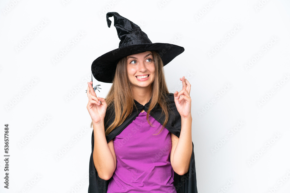 Young caucasian woman costume as witch isolated on white background with fingers crossing Young caucasian woman costume as witch isolated on white background with fingers crossing