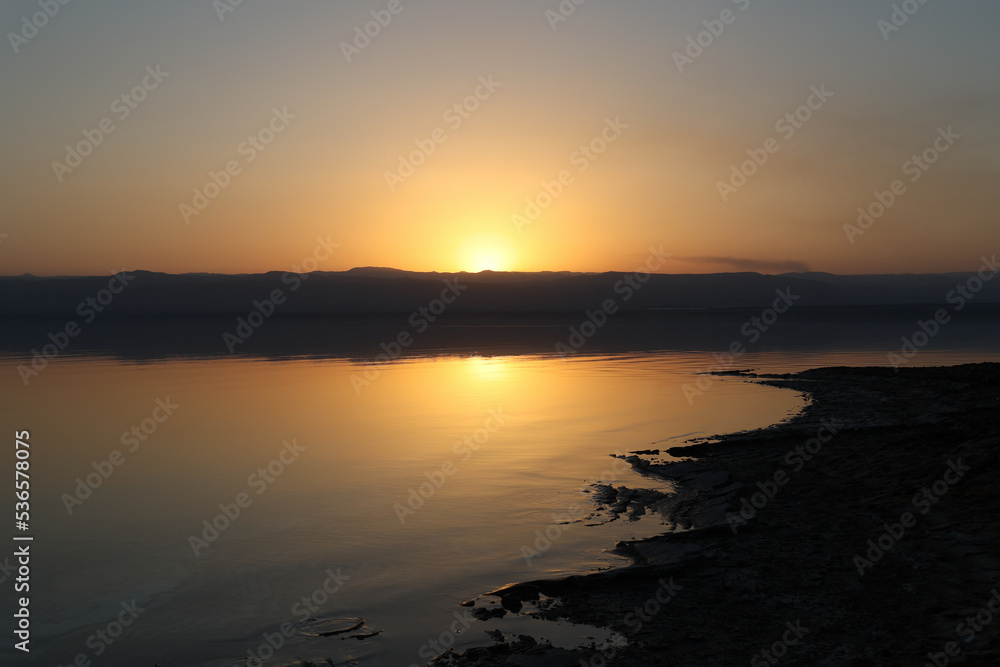 landscape view of coastline of dead sea at sunset
