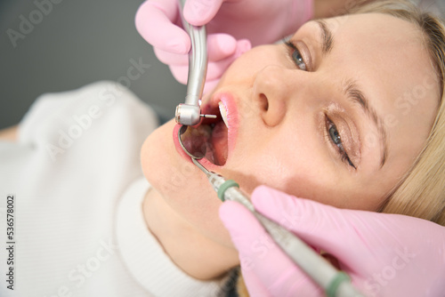 Young lady sitting in a chair being treated for teeth