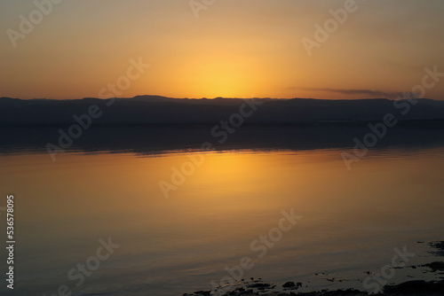 sunset over israel coastline of dead sea in summer