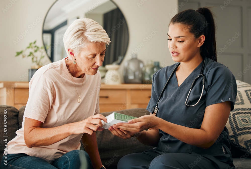 Obraz premium Home, healthcare and doctor help elderly patient in assisted living care facility, explain medicine on a sofa. Support, pills and senior care checkup with nurse discuss option and recovery treatment