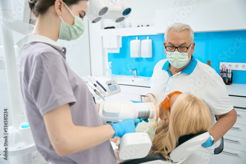 Unrecognized blonde female during the dental care in medicine center