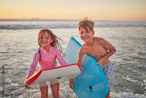 Photography Happy children, beach and learning to surf for fun and bonding on bali summer vacation