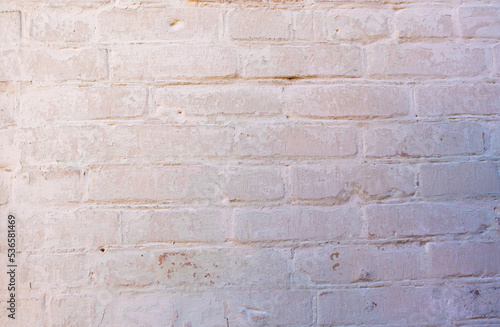 Texture of an old brick wall. The wall is painted with chalk.