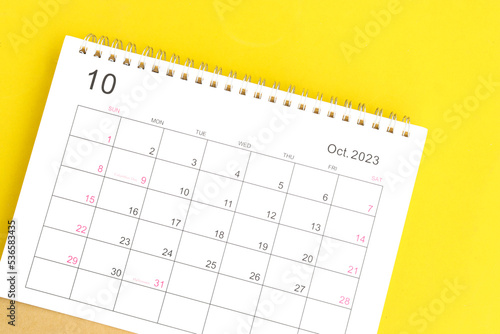 calendar October 2023 top view on yellow a background