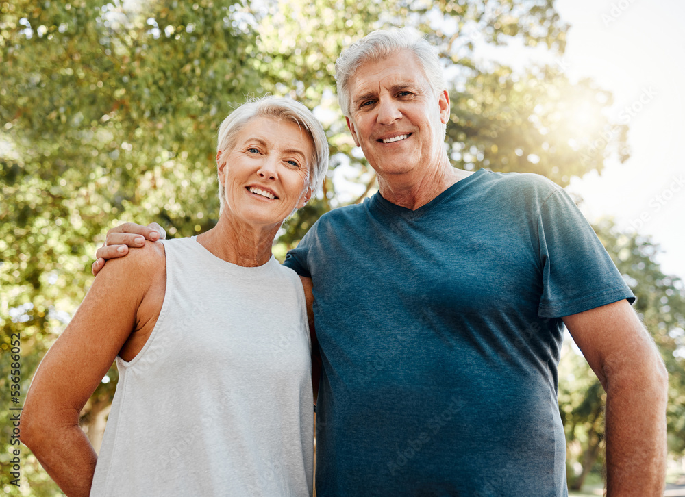 Old couple, hug and nature portrait smile outdoors, park or outside on break after running, walk or exercise. Health, workout and elderly man and woman, walking or spend quality fitness time together