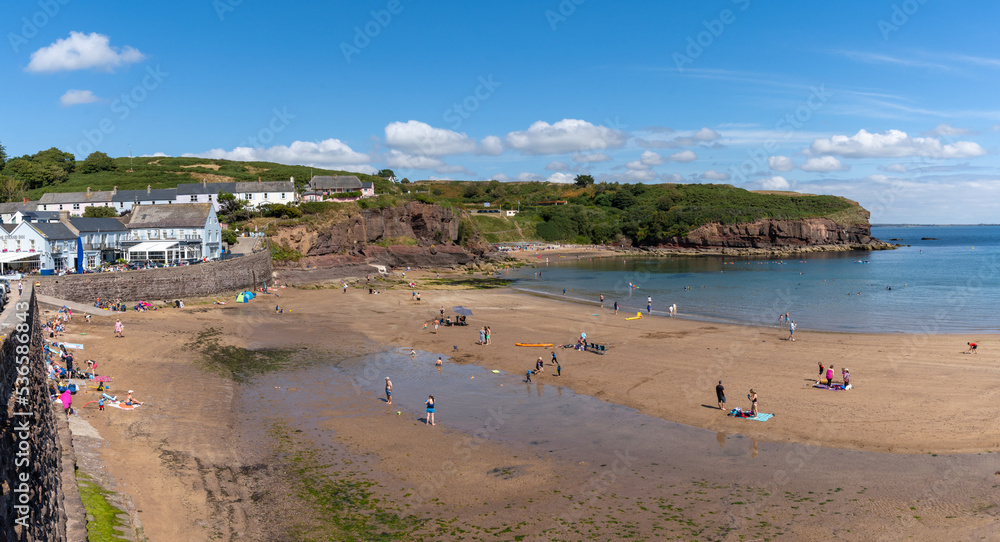the golden sand beach in Dunmore East with many people enjoying a late summer day the golden sand beach in Dunmore East with many people enjoying a late summer day