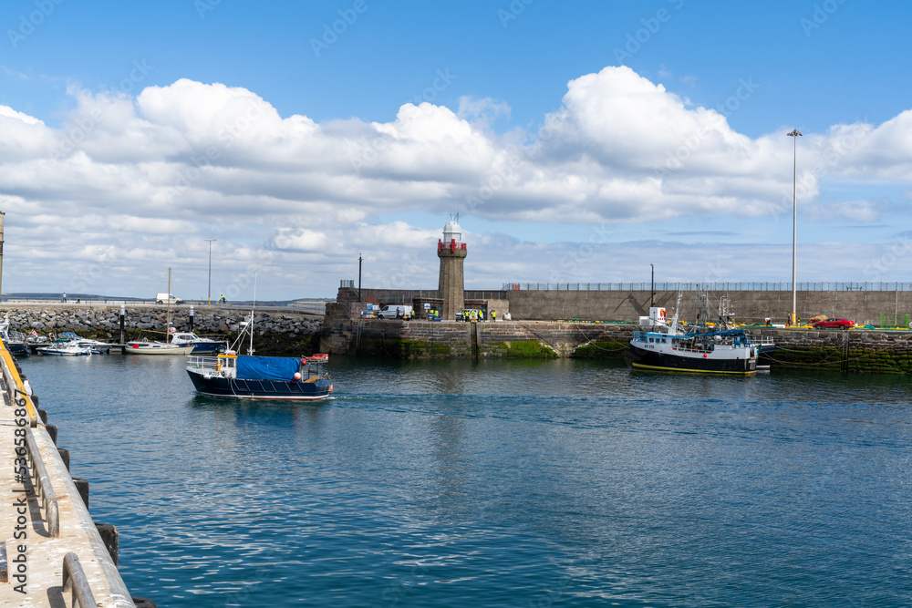 small fishing trawler leaving Dunmore East harbor and heading out to the Irish Sea