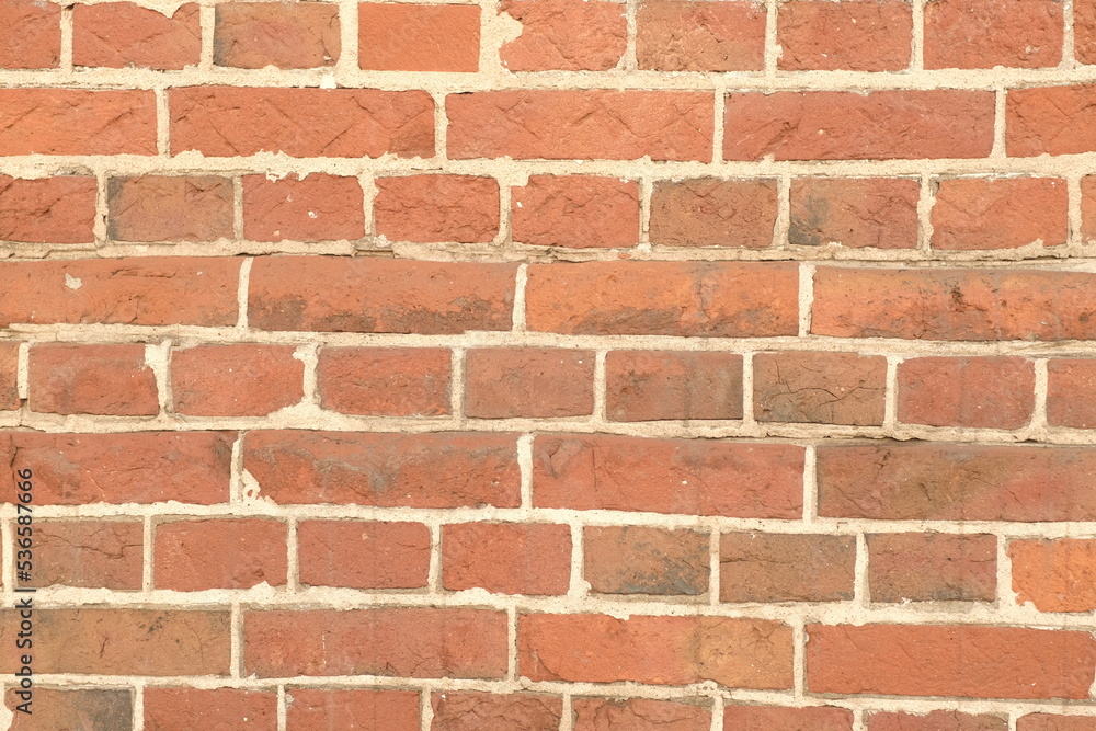 Rough aged masonry background. Backdrop of old red bricks with shabby texture Rough aged masonry background. Backdrop of old red bricks with shabby texture