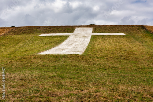 The Lenham Cross is a chalk cross carved into the hillside to the north of Lenham in Kent, in England. photo