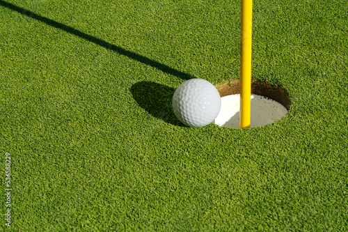 Vászonkép Close-up of Golf Course Green, Flag Pin and Ball.