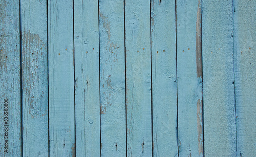 Wooden blue painted fence, table surface. Weathered background