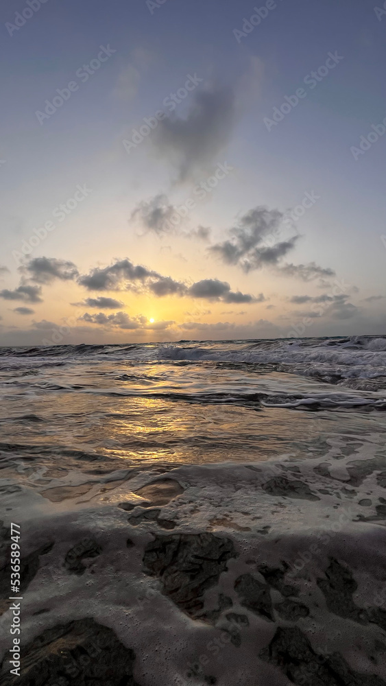 sunset at sea, white waves and variety of colors sunset at sea, white waves and variety of colors
