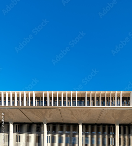 White Toned Square Building with a Flat Roof Line.