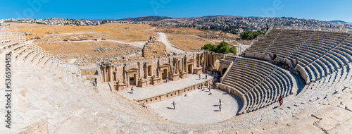 A panorama view over the amphitheatre and the ancient Roman settlement of Gerasa in Jerash, Jordan in summertime photo