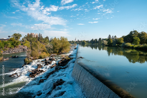 Konstfotografi Beautiful view of Idaho waterfall falling to Snake river near temple