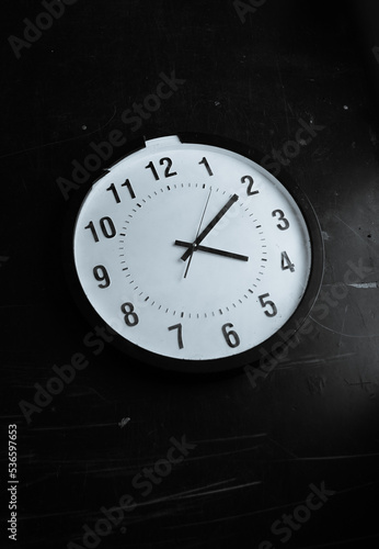 black and white photo of a clock