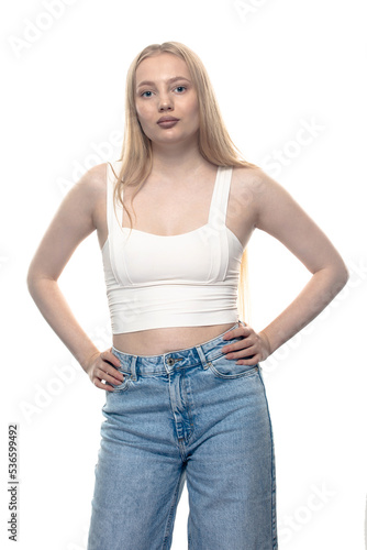 Blonde girl in jeans isolated on white © Vitalii Hulai