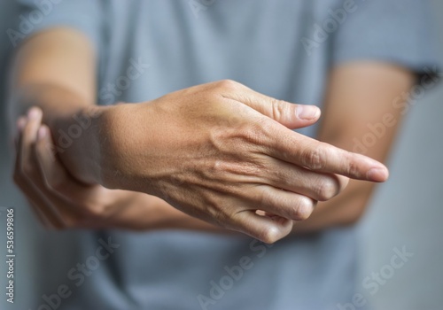 Fotobehang Fingers rigidity, Hand muscles spasm, or Weakness of digits.