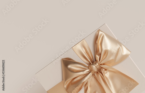 3D gift box, golden ribbon bow on beige pastel background. Present mockup for cosmetic product . Realistic gift. Copy space banner, card for text. Birthday, valentine or Christmas 3d render. Flatlay
 photo