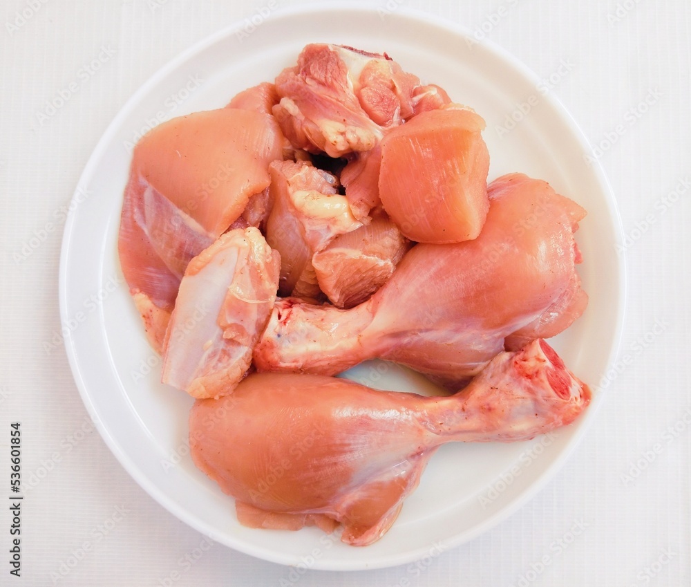 Raw fresh chicken meat white-meat murghi ka gosht boti raw-frango raw-poulet, food uncooked poultry-meat raw-pollo hen-meat cut pieces on a plate fillets and drumstick bird-meat closeup image photo Raw fresh chicken meat white-meat murghi ka gosht boti raw-frango raw-poulet, food uncooked poultry-meat raw-pollo hen-meat cut pieces on a plate fillets and drumstick bird-meat closeup image photo