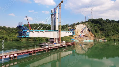 aerial view of building bridge over fuchun river in blue cloud sky photo