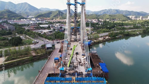 aerial view of building bridge over fuchun river in blue cloud sky photo