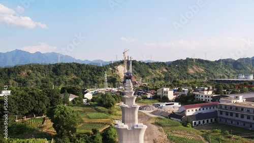 aerial view of building bridge over fuchun river in blue cloud sky photo