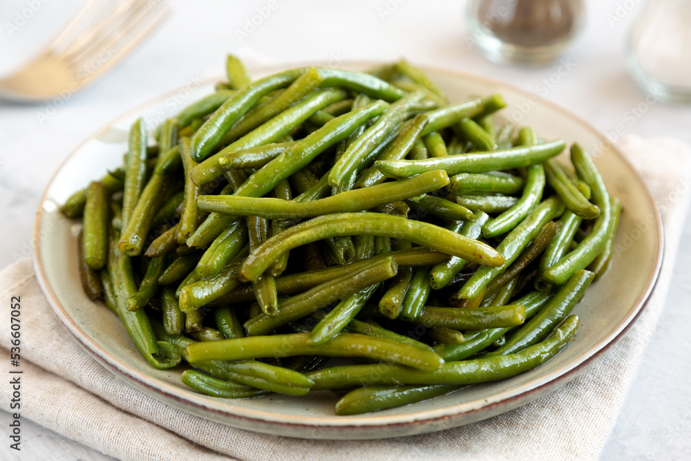 Homemade Sauteed Green Beans on a Plate, side view. Homemade Sauteed Green Beans on a Plate, side view.