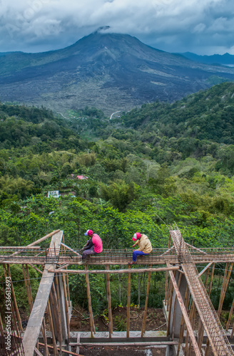 Building construction on steep mountain slopes is fraught with danger. Developing country infrastructure as well as environmental destruction. photo