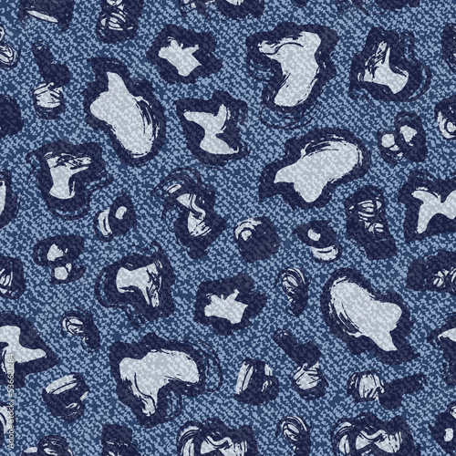 Spotted Jeans background. Vector Denim Leopard Seamless Pattern. Blue jeans cloth. Grunge brush strokes Spots.