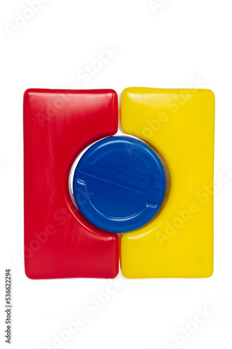 Plastic colored cube made up of different shapes. Children's educational game