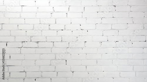 Old rough white painted brick wall large texture. Whitewashed brickwork masonry backdrop. Light grunge abstract background 